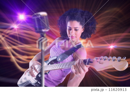 Composite image of pretty girl playing guitar Composite image of pretty girl playing guitar 11620913