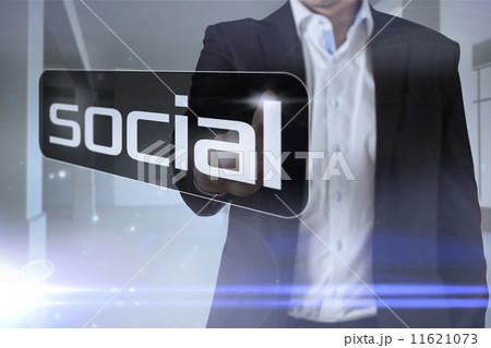 Businessman pointing to word social Businessman pointing to word social 11621073