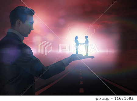 Composite image of businessman holding business partners 11621092
