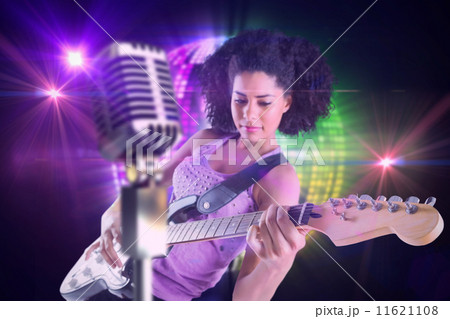 Composite image of pretty girl playing guitar Composite image of pretty girl playing guitar 11621108