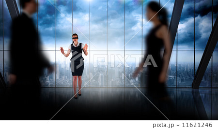 Composite image of business people walking in a blur 11621246