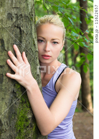 Young woman hugging a tree. Young woman hugging a tree. 11622657