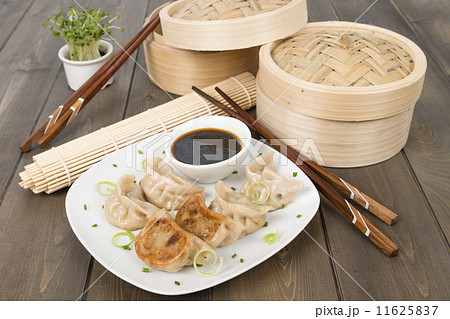 Yaki-Gyoza - Japanese pan-fried dumplings with dipping sauce  11625837