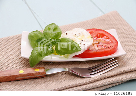 Basil leaf, mozzarella cheese, tomato slice, fork Basil leaf, mozzarella cheese, tomato slice, fork 11626195