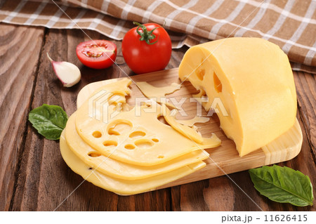 Cheese on a cutting board, basil, tomato Cheese on a cutting board, basil, tomato 11626415