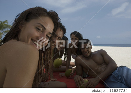 Multi-ethnic friends at beach 11627784
