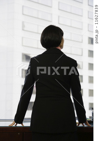 Businesswoman gazing out window 11627839