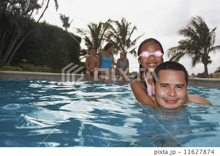 Hispanic father and daughter in swimming pool 11627874