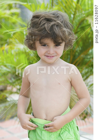 Hispanic boy wearing bathing suit 11628097