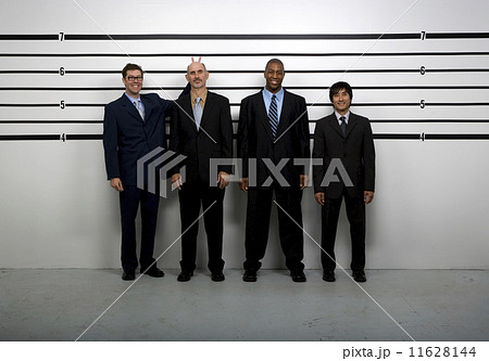 Multi-ethnic businessmen being silly in police line up Multi-ethnic businessmen being silly in police line up 11628144