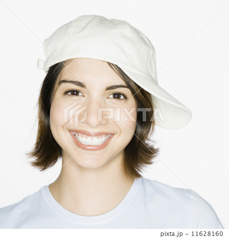 Mixed Race woman wearing sideways painter's hat 11628160