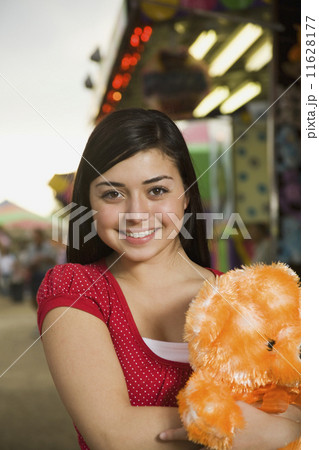 Mixed Race teenaged girl at carnival  11628177