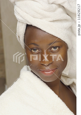 Close up of African American woman wearing bathrobe 11628217
