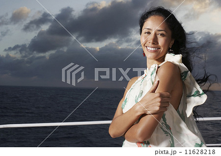 Hispanic woman with water in background 11628218