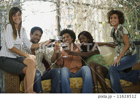 South American friends toasting at party 11628512