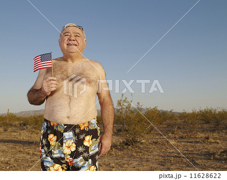 Senior Mixed Race man wearing bathing suit in desert 11628622