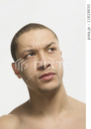 Mixed Race man looking skeptical 11628650