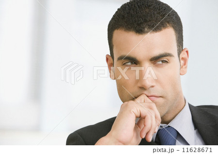 Hispanic businessman thinking Hispanic businessman thinking 11628671