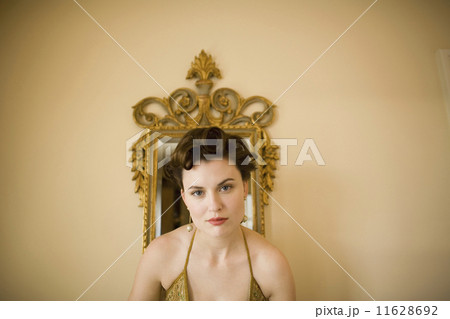 Close up of woman in front of mirror Close up of woman in front of mirror 11628692