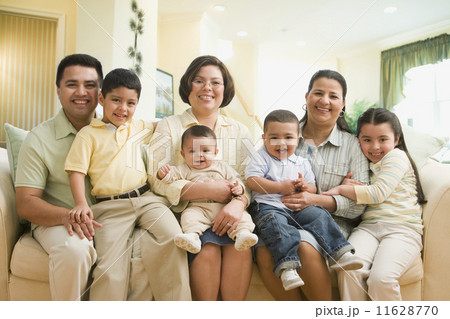 Multi-ethnic family on sofa Multi-ethnic family on sofa 11628770