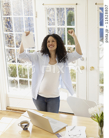 Pregnant African woman cheering Pregnant African woman cheering 11628807