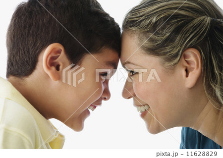 Hispanic mother and son touching foreheads Hispanic mother and son touching foreheads 11628829
