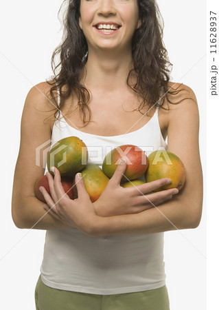 Young woman holding fruit 11628937