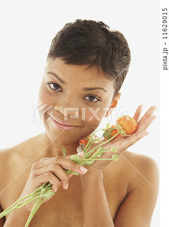 African American woman holding flowers 11629015