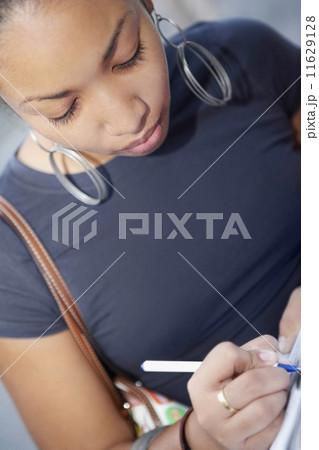 African woman writing 11629128