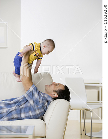 Asian father playing with baby Asian father playing with baby 11629260