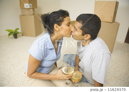 Indian couple kissing in new house 11629370