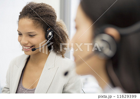 African businesswoman wearing headset 11629399