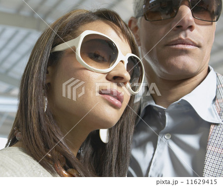 Close up of couple in airplane hanger  11629415