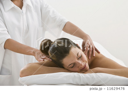 Woman receiving massage Woman receiving massage 11629476