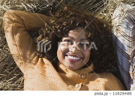 African American woman laying in field 11629486