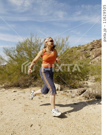 Senior Hispanic woman jogging Senior Hispanic woman jogging 11629505