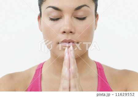 Close up of teen girls face while meditating 11629552