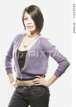 Asian woman with hands on hips 11629568