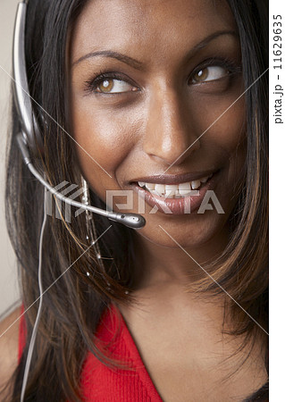 Indian businesswoman wearing headset 11629635