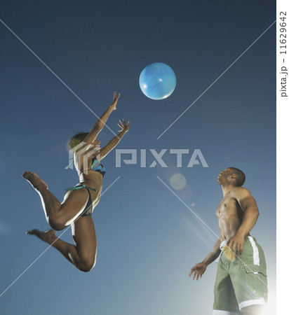 African American couple playing with beach ball 11629642