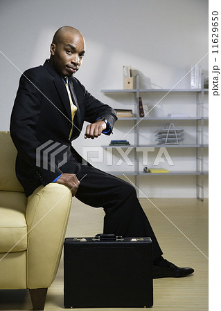 African American businessman checking watch 11629650