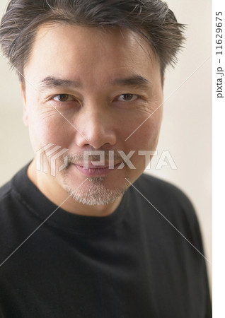 Close up of Asian man smiling 11629675