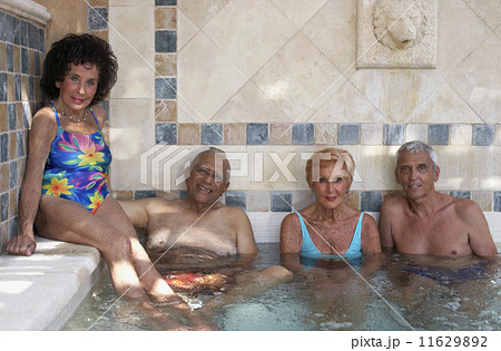 Group of seniors in hot tub 11629892