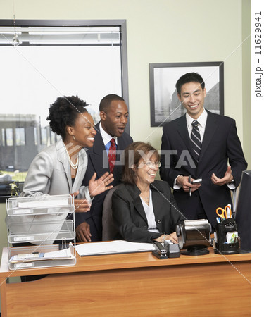Multi-ethnic businesspeople cheering 11629941