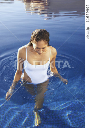 Woman walking in pool 11629992