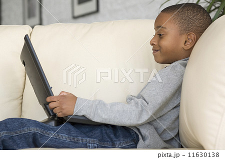 African boy looking at laptop 11630138