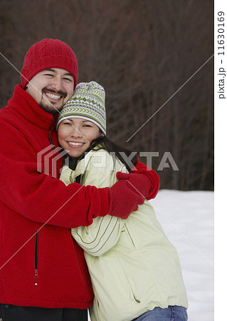 Mixed Race couple hugging Mixed Race couple hugging 11630169