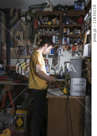 Middle Eastern man in home workshop Middle Eastern man in home workshop 11630218