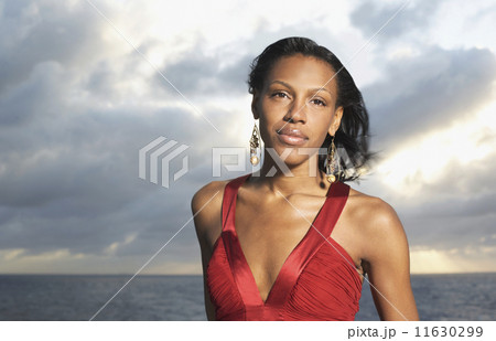 Mixed Race women wearing evening gown 11630299