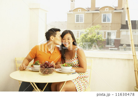 Asian couple at breakfast table Asian couple at breakfast table 11630478